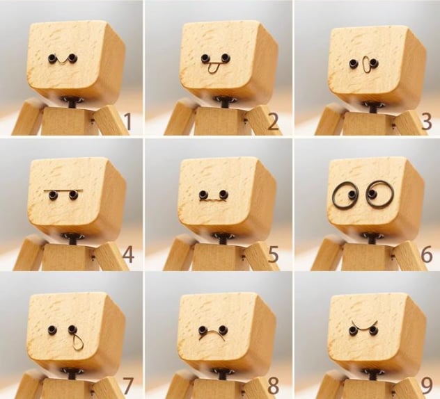 Charmante kleine Holzfigur mit 12 magnetischen Gesichtsausdrücken